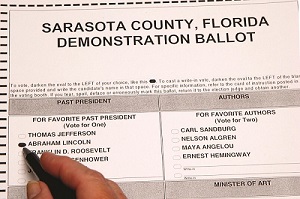 Hand of a person marking a Sarasota County demonstration ballot